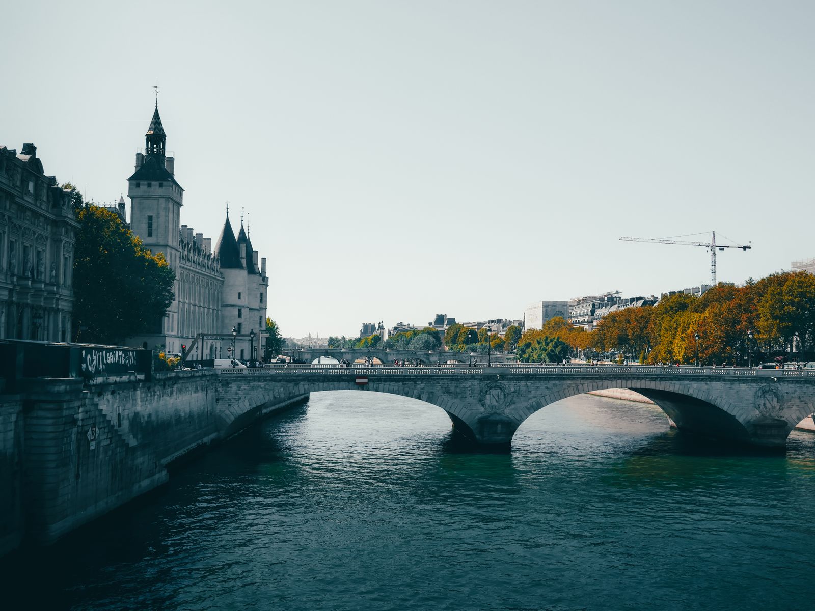 The Conciergerie and a bridge beside the Seine in Paris